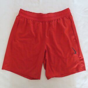 NIKE Yoga Dri Fit Shorts Size Medium Stretch Cinnabar Orange Zip pocket